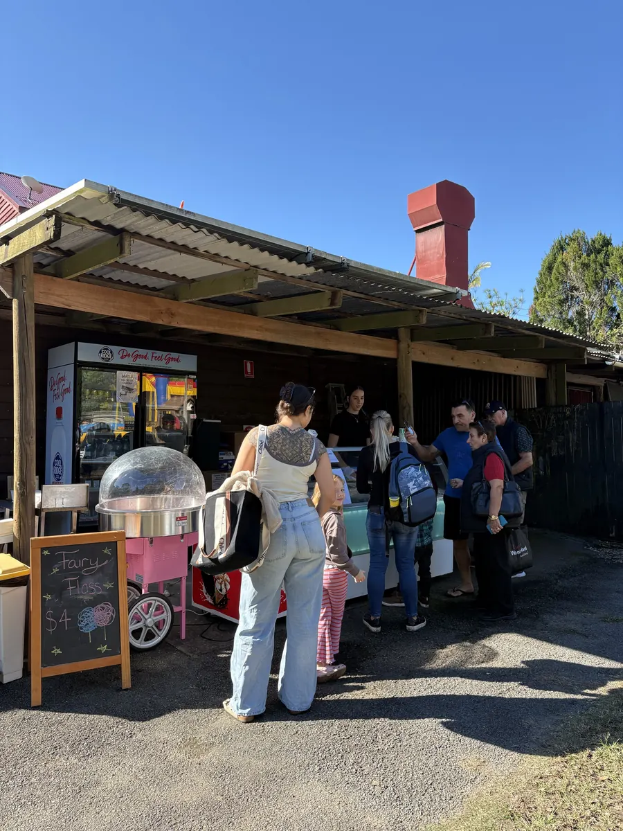Visitors gathered at the fairy floss cart and serving window during the event