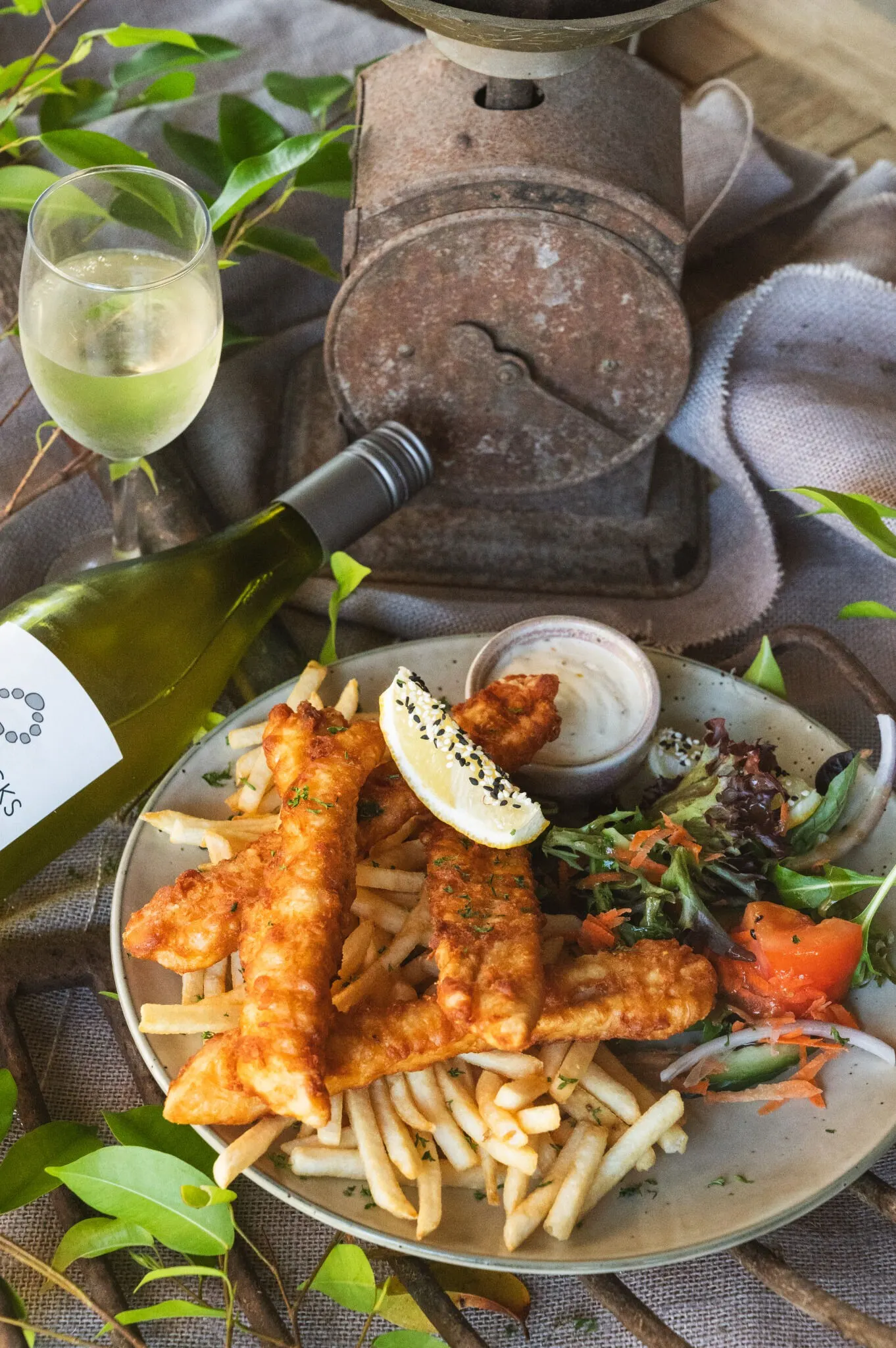 Battered fish and chips with a fresh garden salad, lemon and tartare at the Rivermill Café