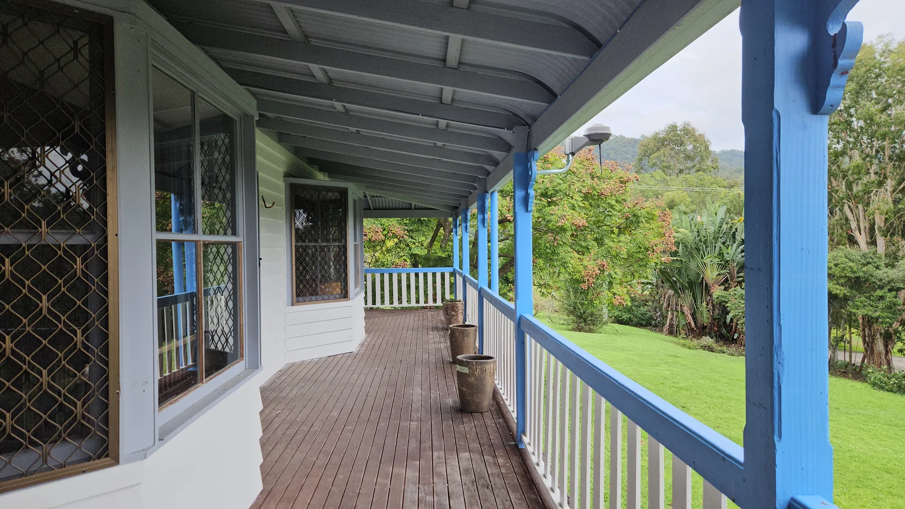 The wraparound verandah looking out over the lawn to the hills