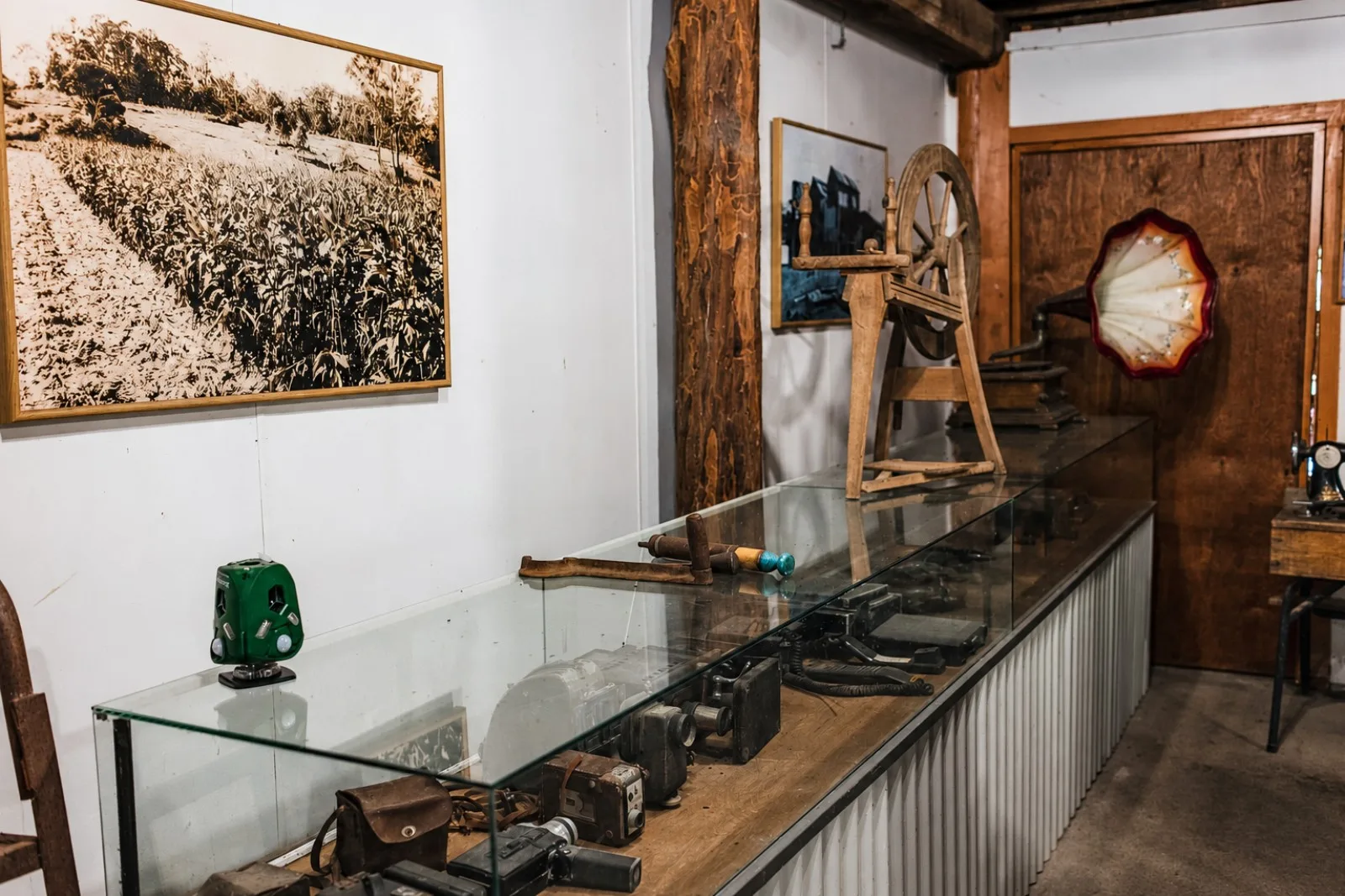 Photographs and antiques on display inside the mill museum at Historic Rivermill