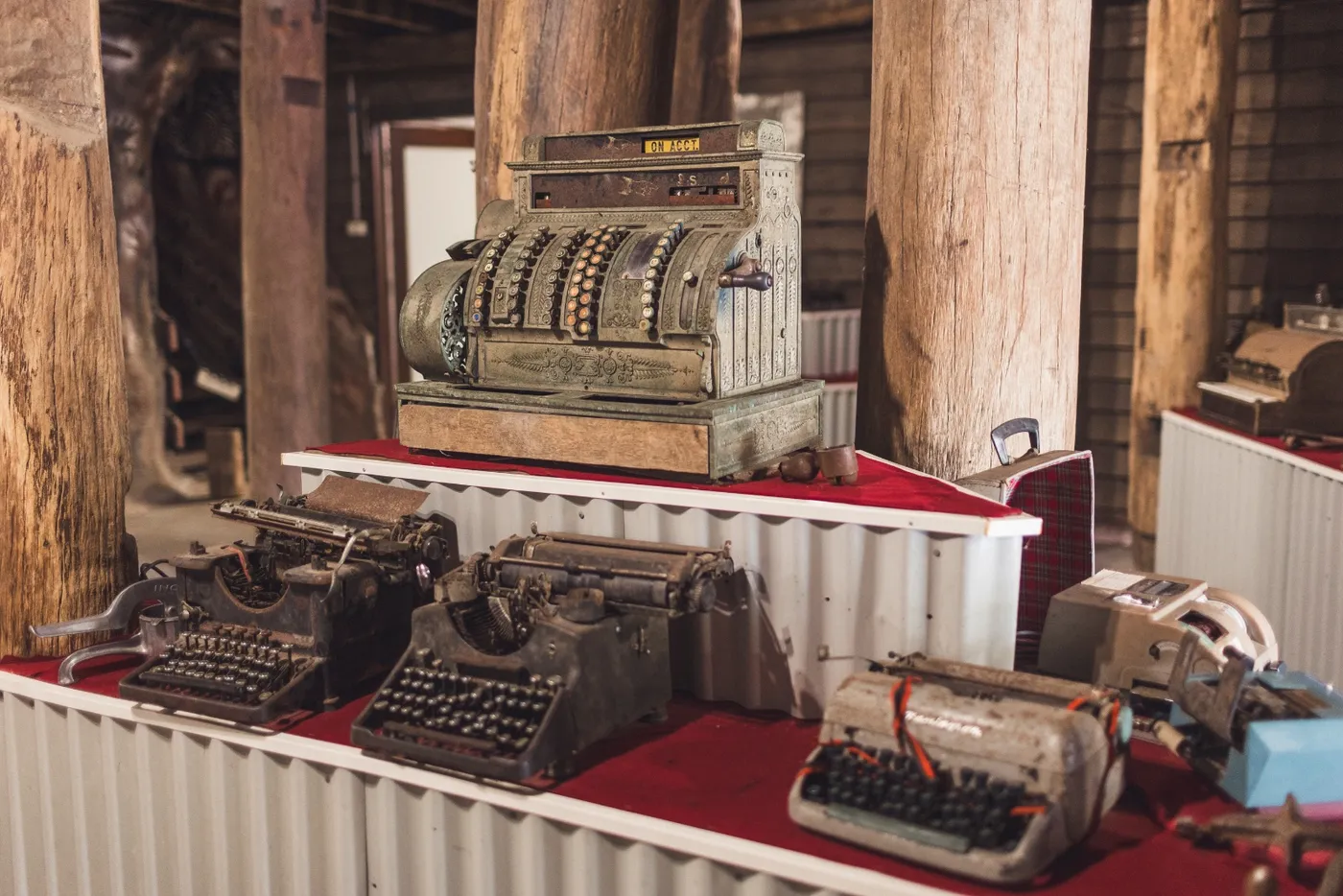 Antique cash register and typewriters on display in the Rivermill museum